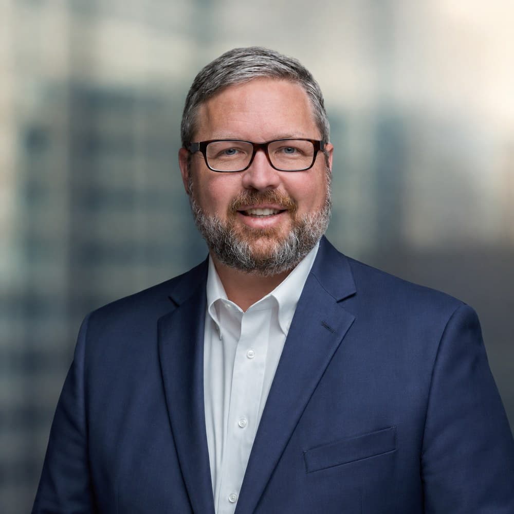 Mark Tucker, CFA, Chief Investment Officer